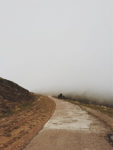 road near hill with fog thumbnail