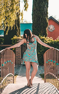 woman wearing green and multicolored floral tank dress thumbnail