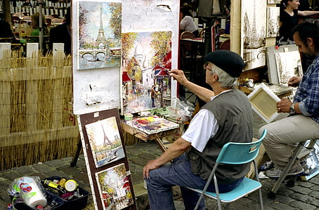 man painting on easel thumbnail