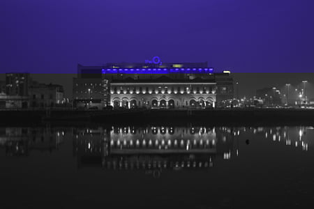 lighted building near body of water thumbnail