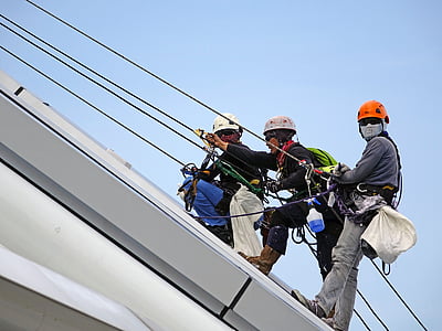 three men rapelling on white steel roof thumbnail