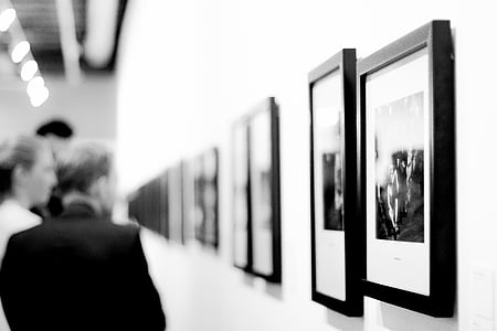 man standing in front of painting thumbnail