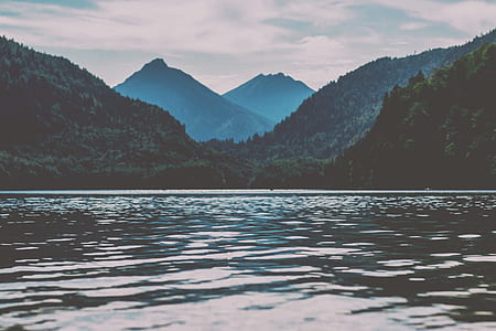 calm sea beside mountains thumbnail