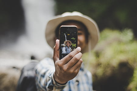 person taking selfie thumbnail