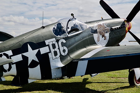 selective focus photography of black aircraft outdoor thumbnail