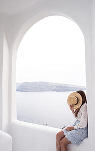 woman sitting on window thumbnail