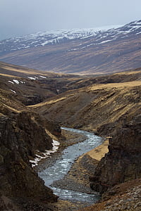 river beside mountain thumbnail