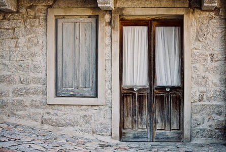 closed brown wooden door and window thumbnail