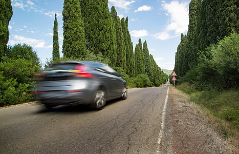 timelapse photography of gray SUV on road thumbnail
