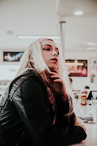portrait photo of woman sitting in room thumbnail