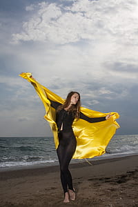 woman raising yellow cloth thumbnail
