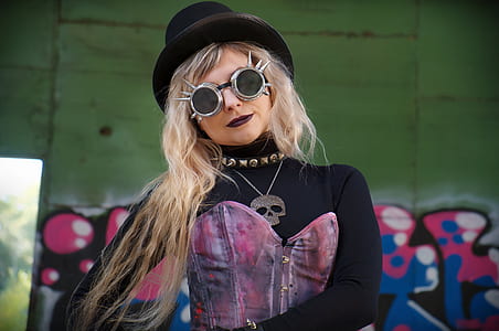 woman wearing costume posing near wall with graffiti thumbnail