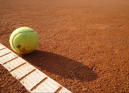 green tennis ball on floor thumbnail