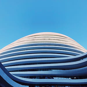 white and beige concrete building during daytime thumbnail