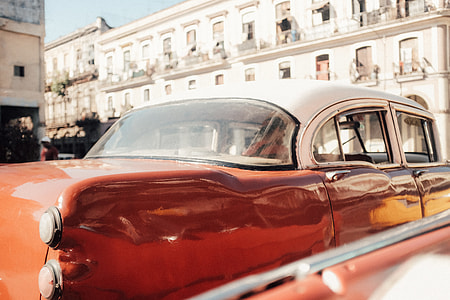 red and white convertible coupe during daytime photography thumbnail