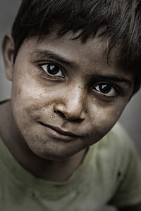 selective focus photo of smiling boy wearing yellow shirt thumbnail