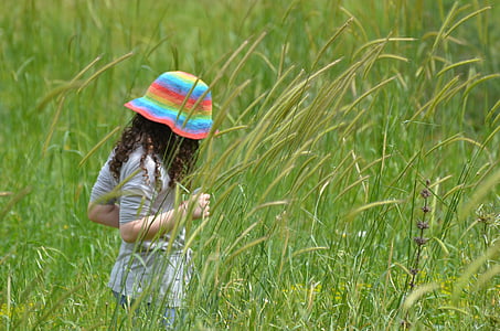 woman standing on grass field thumbnail