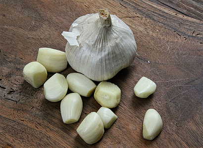 sliced garlic near white whole garlic thumbnail