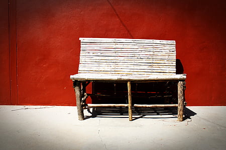 brown wooden bench near red wall paint thumbnail