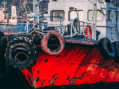 red and black sailboat near boats thumbnail