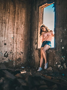 woman in window looking on floor thumbnail