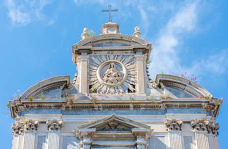white cathedral structure with cross on roof thumbnail