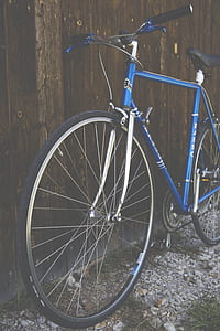 Blue City Bike Beside Brown Wooden Fence thumbnail