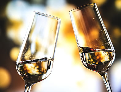 Bokeh Photo of Two Toast Clear Glass Wine Glasses thumbnail