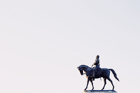 man riding horse statue with white background thumbnail