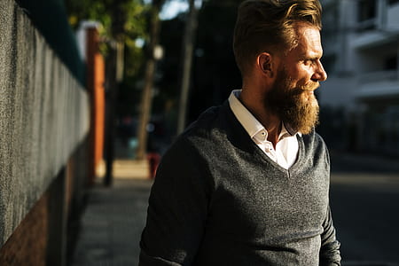 man standing beside gate thumbnail