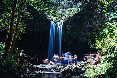 timelapse photo of people near waterfalls at daytime thumbnail