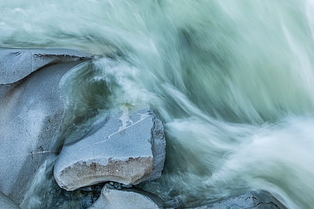 gray rock beside body of water thumbnail