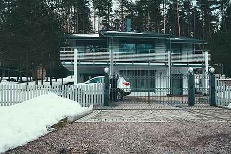 white SUV parked in front of house at daytime thumbnail