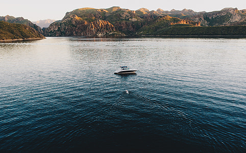 boat on river during daytime thumbnail