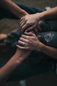 two people holding hands inside room thumbnail