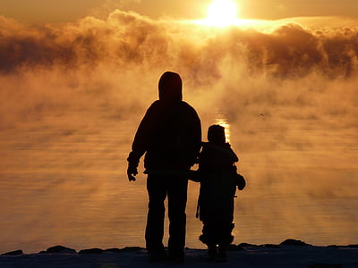 silhouette of person standing on mountain thumbnail