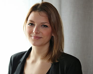 woman wearing black blazer and black scoop-neck top thumbnail