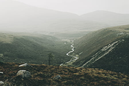 aerial photography of hill and mountain at daytime thumbnail