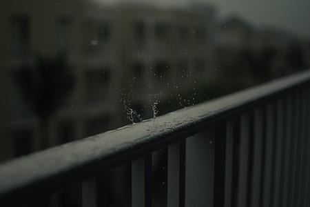 shallow focus photo of raindrops on black steel fence thumbnail