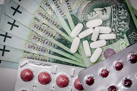bunch of tablet medicines beside blister packs thumbnail
