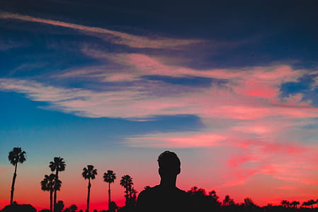 silhouette of man standing during sunset thumbnail