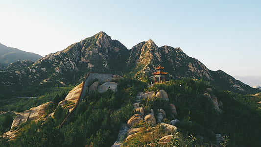 pagoda on mountain range photograph thumbnail