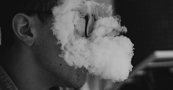 person's face covered with smoke thumbnail