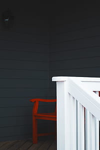 empty chair near wall thumbnail