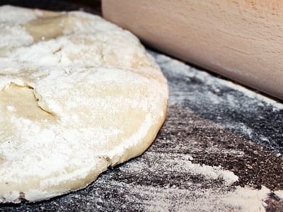 dough on brown wooden surface close up photo thumbnail