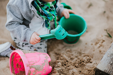 Toddler playing in the sand thumbnail