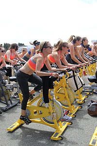 woman taking stationary bike thumbnail