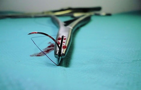 gray operating needle with blood stain thumbnail