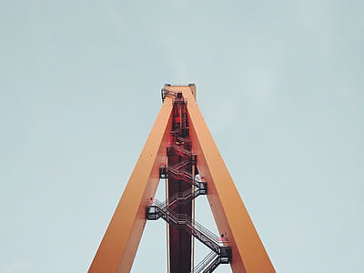 worm's-eye view of orange tower thumbnail