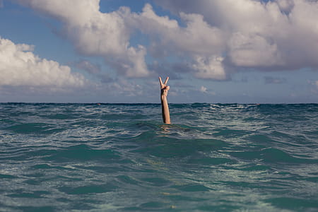 Vacation Peace Sign In Ocean Photo thumbnail